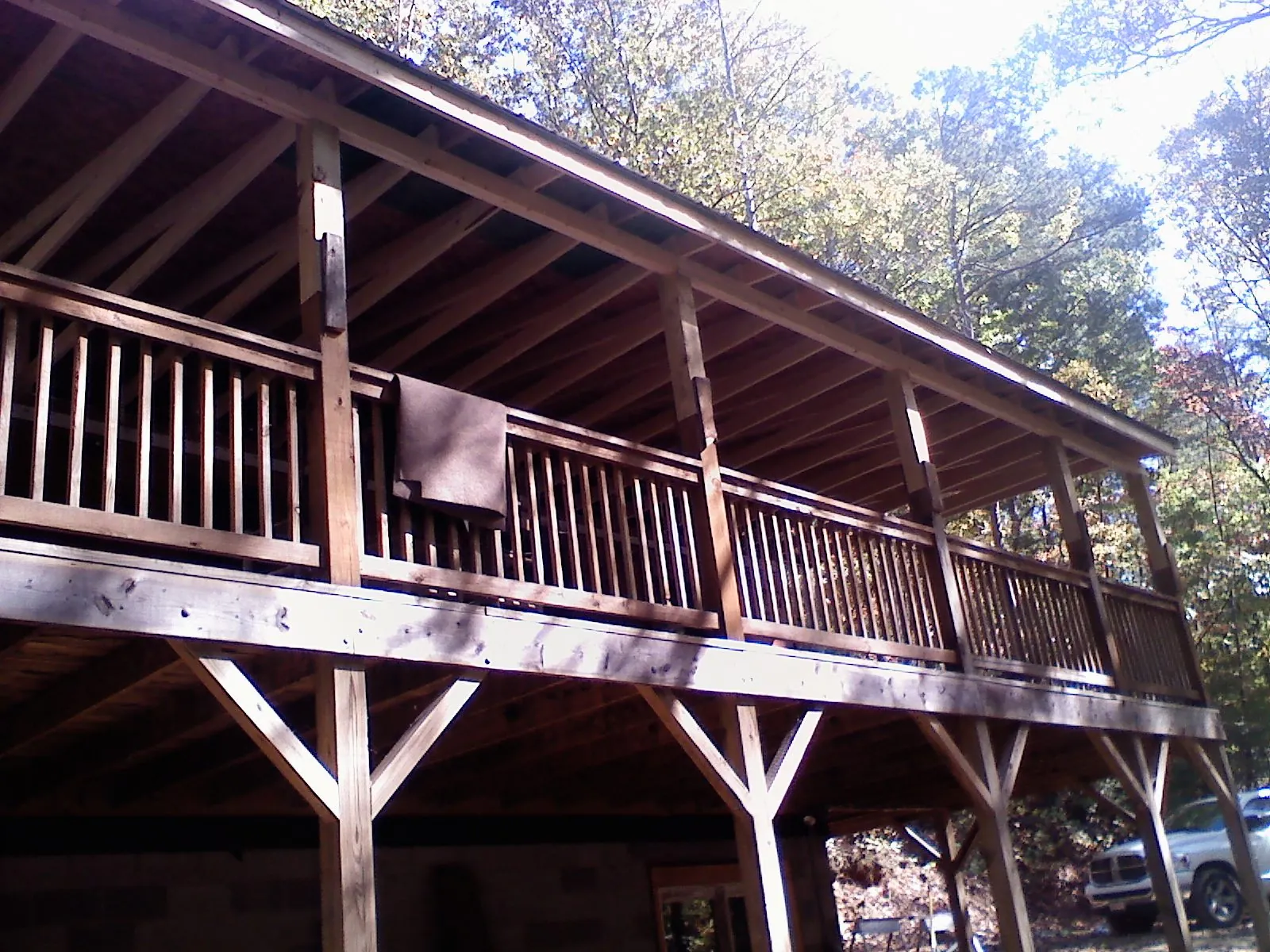 Timber framing under a new elevated porch and deck — Roof Leak Repair in Overland Park by Roofing Brothers